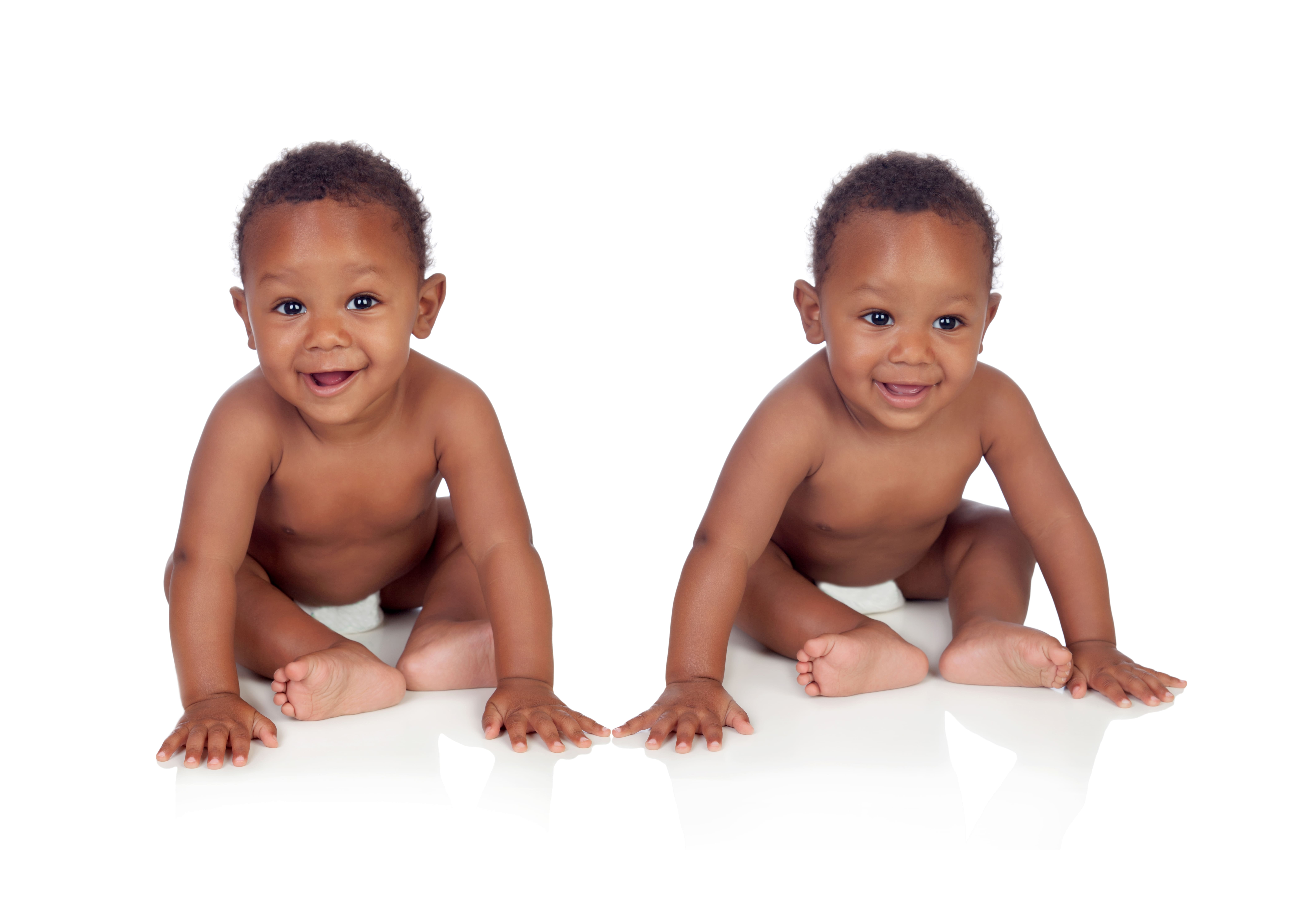 African twin brothers isolated on a white background Two women holding babies that were saved by ICU Mobile